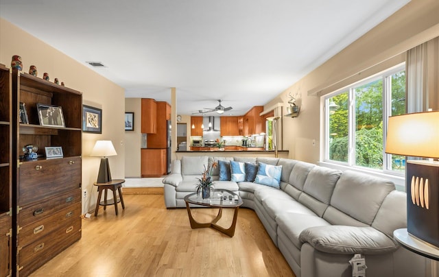 34 Oak Meadow Rd, Commack, NY 11725 - living area with light wood-type flooring and a ceiling fan