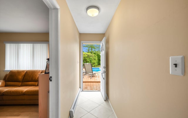 34 Oak Meadow Rd, Commack, NY 11725 - corridor featuring light tile patterned floors and baseboard heating