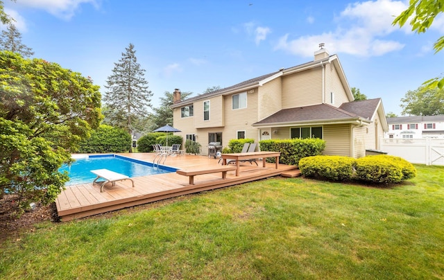 34 Oak Meadow Rd, Commack, NY 11725 - back of house featuring a chimney and a wooden deck