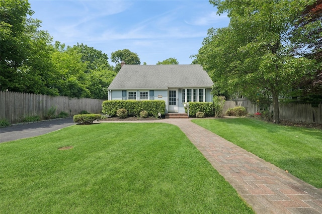 15 W Hemlock St, Islip, NY 11751 - view of front facade featuring a chimney