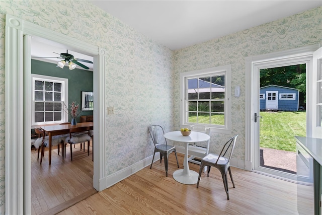 105 James St, Hastings-On-Hudson, NY 10706 - dining space with light wood finished floors, wallpapered walls, a ceiling fan, and baseboards