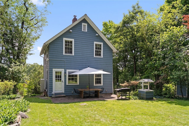 105 James St, Hastings-On-Hudson, NY 10706 - rear view of house with a chimney, a patio, and a yard