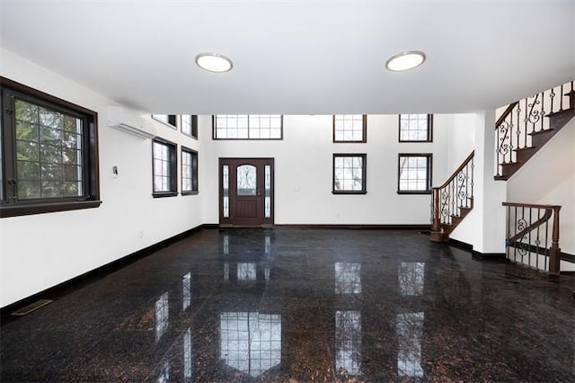 63-39 136th St, Flushing, NY 11367 - foyer entrance with granite floors, plenty of natural light, stairway, and an AC wall unit