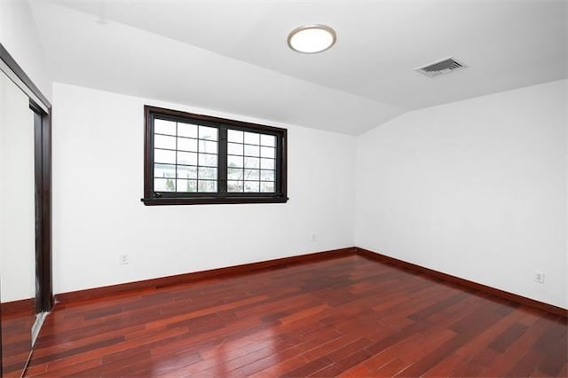 63-39 136th St, Flushing, NY 11367 - unfurnished bedroom with wood finished floors, vaulted ceiling, and a closet
