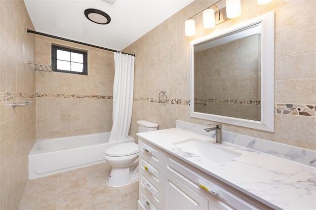 63-39 136th St, Flushing, NY 11367 - full bath with tile walls, vanity, shower / bathtub combination with curtain, and tile patterned flooring