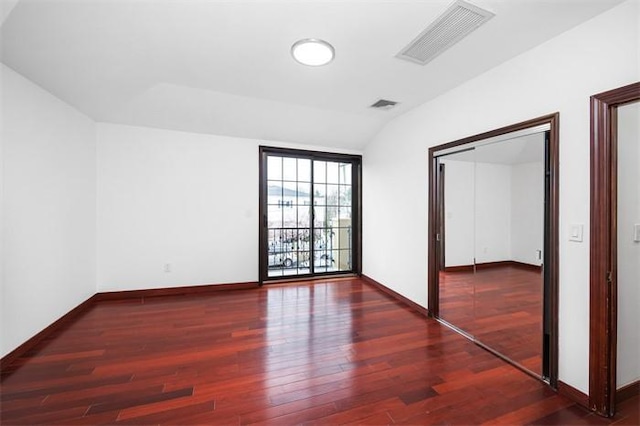 63-39 136th St, Flushing, NY 11367 - unfurnished room with wood finished floors and vaulted ceiling