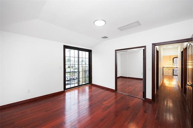 63-39 136th St, Flushing, NY 11367 - unfurnished bedroom with vaulted ceiling, hardwood / wood-style floors, and a closet