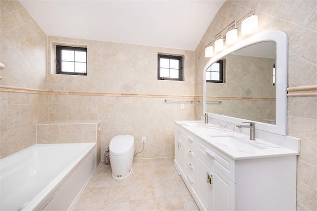 63-39 136th St, Flushing, NY 11367 - bathroom featuring tile walls, double vanity, a tub, and vaulted ceiling