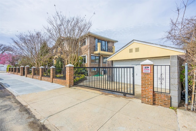 63-39 136th St, Flushing, NY 11367 - view of front facade featuring a fenced front yard, a garage, brick siding, and a gate