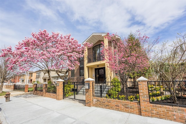 63-39 136th St, Flushing, NY 11367 - view of front facade featuring a fenced front yard and a balcony