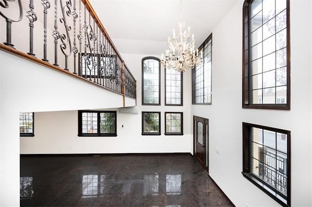 63-39 136th St, Flushing, NY 11367 - entryway with granite floors, a towering ceiling, and a chandelier