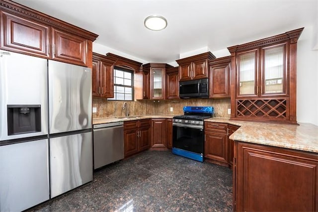 63-39 136th St, Flushing, NY 11367 - kitchen featuring appliances with stainless steel finishes, granite floors, tasteful backsplash, glass insert cabinets, and light stone counters