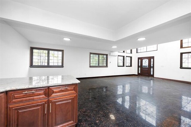 63-39 136th St, Flushing, NY 11367 - kitchen with granite tiled floors, recessed lighting, open floor plan, and light stone counters