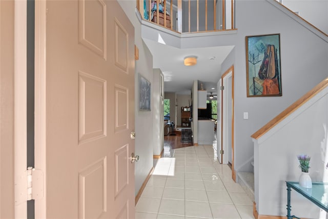 4 Hudson Watch Dr Unit 4, Ossining, NY 10562 - foyer entrance with light tile patterned flooring, stairway, and a high ceiling