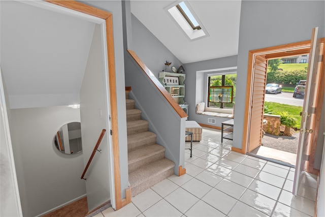 4 Hudson Watch Dr Unit 4, Ossining, NY 10562 - entrance foyer featuring a skylight, lofted ceiling, stairway, and light tile patterned floors