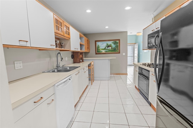 4 Hudson Watch Dr Unit 4, Ossining, NY 10562 - kitchen featuring black appliances, light countertops, open shelves, recessed lighting, and light tile patterned floors