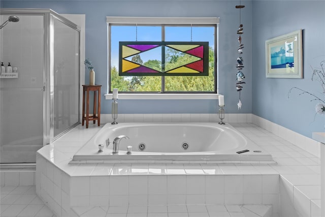 4 Hudson Watch Dr Unit 4, Ossining, NY 10562 - bathroom featuring a stall shower, a tub with jets, and plenty of natural light