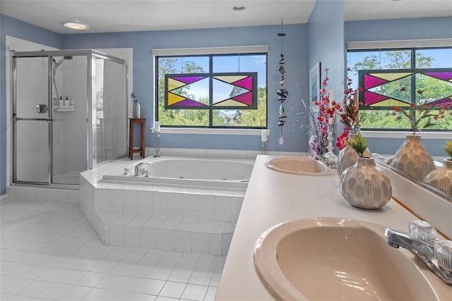 4 Hudson Watch Dr Unit 4, Ossining, NY 10562 - bathroom featuring a jetted tub, a shower stall, tile patterned flooring, and healthy amount of natural light