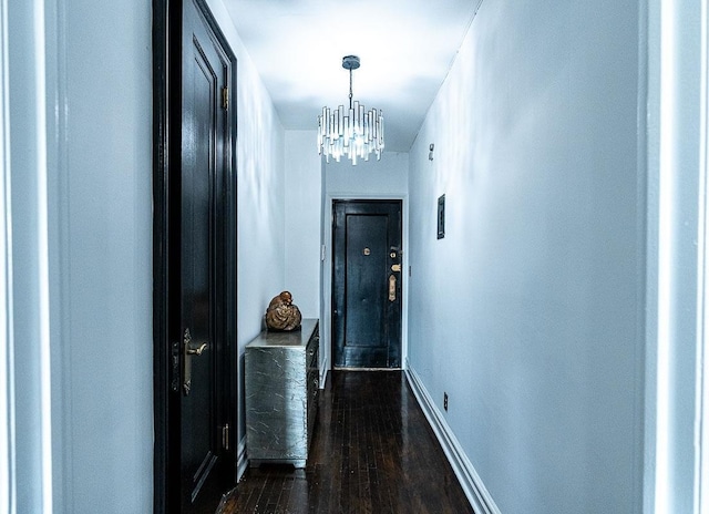 160-15 Powells Cove Blvd Unit E302, Whitestone, NY 11357 - corridor featuring a chandelier, dark wood-style floors, and baseboards