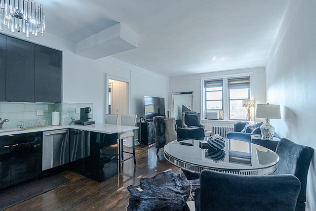 160-15 Powells Cove Blvd Unit E302, Whitestone, NY 11357 - dining room featuring dark wood finished floors, crown molding, radiator heating unit, and a chandelier