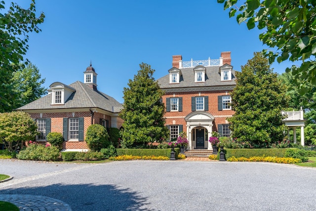 7 Fox Meadow Ln, Lloyd Harbor, NY 11743 - georgian-style home featuring brick siding and a chimney