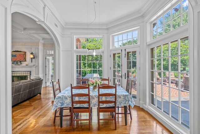 7 Fox Meadow Ln, Lloyd Harbor, NY 11743 - sunroom featuring french doors, arched walkways, and coffered ceiling