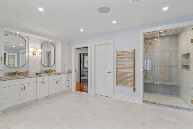 7 Fox Meadow Ln, Lloyd Harbor, NY 11743 - bathroom featuring radiator heating unit, double vanity, a stall shower, marble look tile flooring, and recessed lighting
