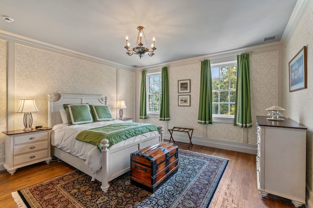 7 Fox Meadow Ln, Lloyd Harbor, NY 11743 - bedroom featuring crown molding, wallpapered walls, wood finished floors, and a chandelier