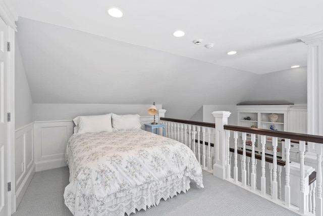 7 Fox Meadow Ln, Lloyd Harbor, NY 11743 - carpeted bedroom featuring lofted ceiling, recessed lighting, a wainscoted wall, and a decorative wall