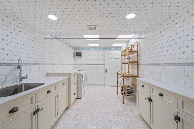 7 Fox Meadow Ln, Lloyd Harbor, NY 11743 - laundry room featuring wallpapered walls, washer / clothes dryer, tile walls, and a wainscoted wall