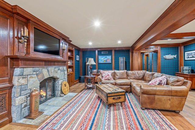 7 Fox Meadow Ln, Lloyd Harbor, NY 11743 - living room featuring recessed lighting, crown molding, light wood finished floors, and a stone fireplace