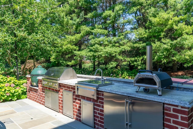 7 Fox Meadow Ln, Lloyd Harbor, NY 11743 - view of patio with area for grilling and view of wooded area