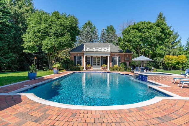 7 Fox Meadow Ln, Lloyd Harbor, NY 11743 - view of pool with a storage structure, an outdoor structure, a patio, a pool with connected hot tub, and a yard