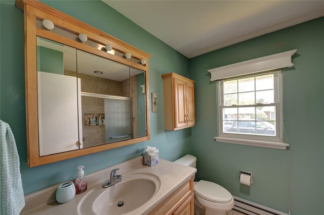 68A Enfield Ct Unit 68A, Ridge, NY 11961 - bathroom featuring a tile shower, vanity, and a baseboard heating unit