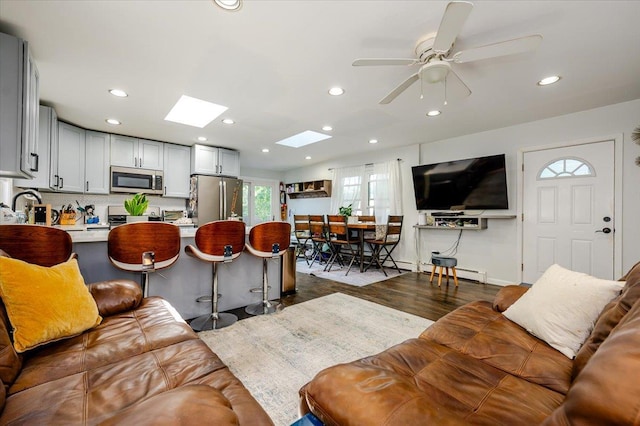 146 First St, Yonkers, NY 10704 - living room featuring recessed lighting, a skylight, dark wood-style flooring, and a ceiling fan