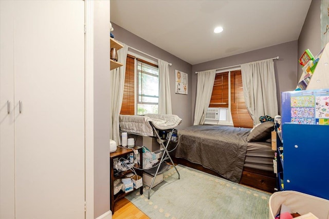 146 First St, Yonkers, NY 10704 - bedroom with wood finished floors and cooling unit