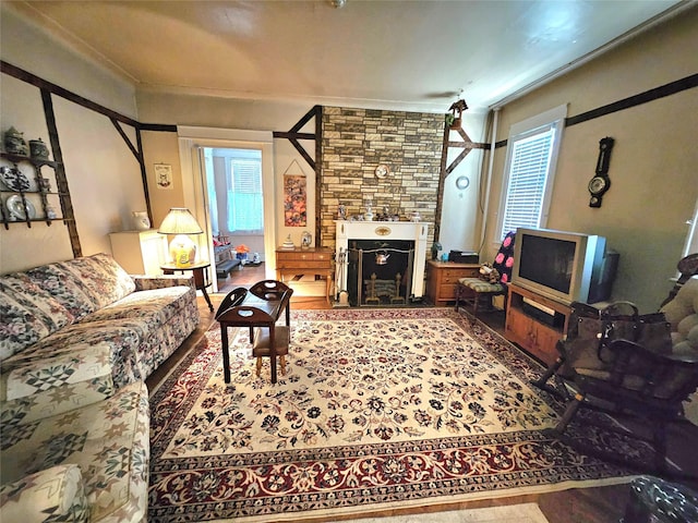 173-12 93rd Ave, Jamaica, NY 11433 - living room with ornamental molding, healthy amount of natural light, and wood finished floors