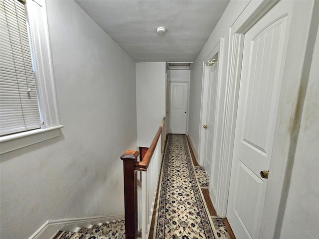 173-12 93rd Ave, Jamaica, NY 11433 - hall featuring baseboards and an upstairs landing