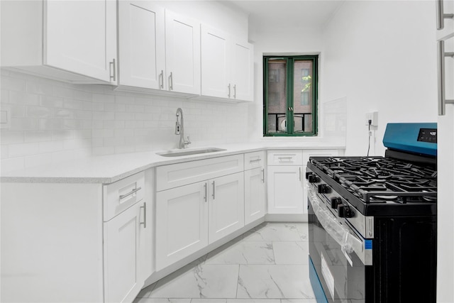 1514 Unionport Rd Unit 1A, Bronx, NY 10462 - kitchen with stainless steel gas range, a sink, light marble finish flooring, light countertops, and white cabinets