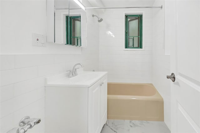 1514 Unionport Rd Unit 1A, Bronx, NY 10462 - full bathroom featuring vanity, marble finish flooring, bathtub / shower combination, and tile walls