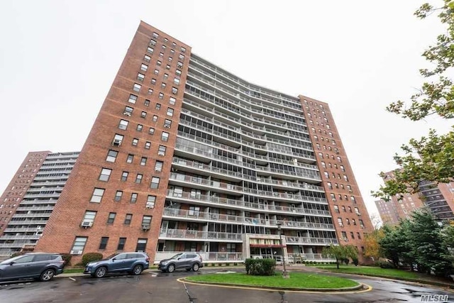 61-55 98th St Unit 14L, Rego Park, NY 11374 - view of property featuring uncovered parking