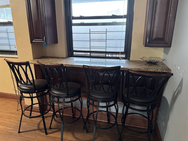 61-55 98th St Unit 14L, Rego Park, NY 11374 - indoor dry bar featuring wood finished floors, healthy amount of natural light, and baseboards
