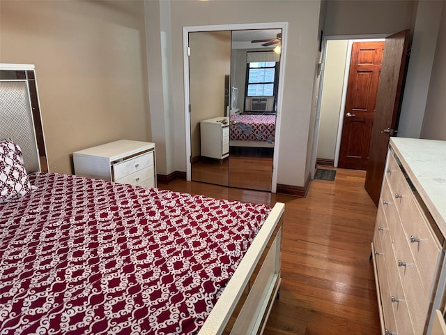 61-55 98th St Unit 14L, Rego Park, NY 11374 - bedroom featuring dark wood finished floors, a closet, cooling unit, and baseboards