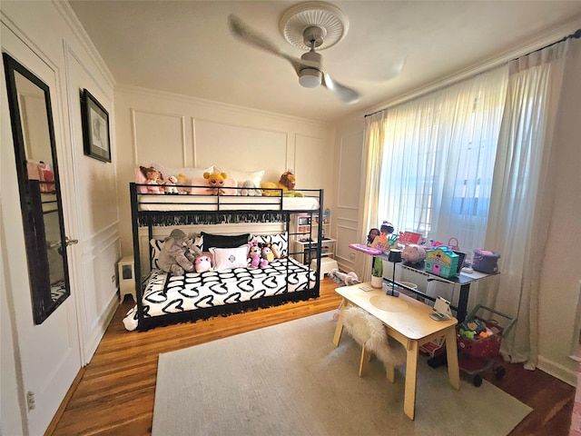 112-25 34th Ave Unit 2D, Corona, NY 11368 - bedroom featuring a decorative wall, wood finished floors, and ornamental molding