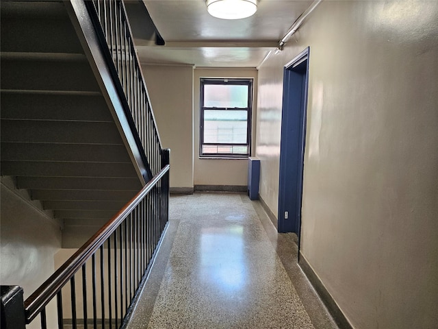 112-25 34th Ave Unit 2D, Corona, NY 11368 - hall with speckle patterned floor, baseboards, and stairway