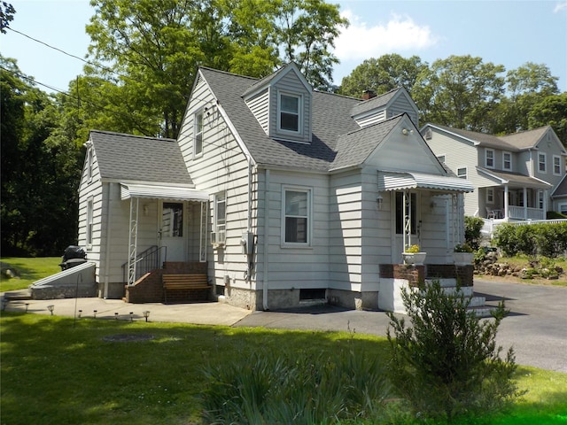 92 Lincoln Blvd, Hauppauge, NY 11788 - view of front of property featuring roof with shingles, a front lawn, and a chimney