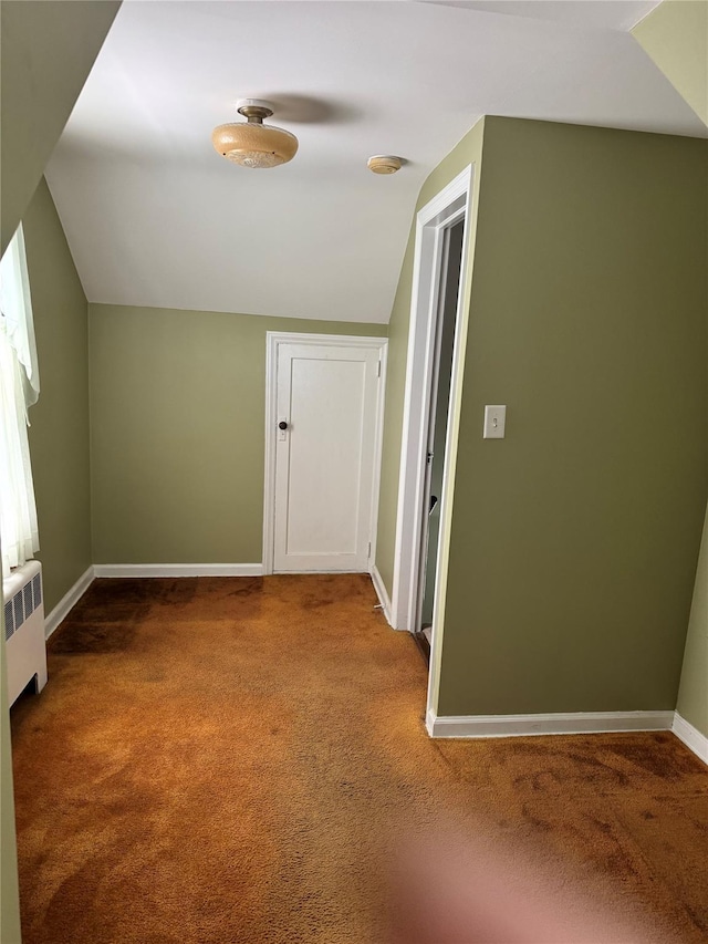 92 Lincoln Blvd, Hauppauge, NY 11788 - additional living space with radiator, carpet floors, and lofted ceiling