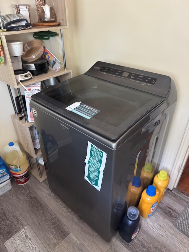1079 Hunter Ave # 1, Valley Stream, NY 11580 - laundry room featuring washer / dryer and wood finished floors