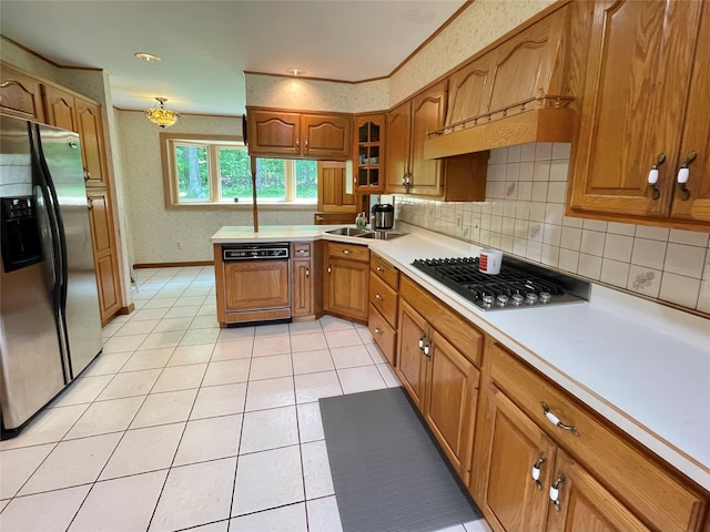 71 Saddleback Ridge Rd, Wallkill, NY 12589 - kitchen with stainless steel appliances, brown cabinets, light countertops, light tile patterned floors, and glass insert cabinets