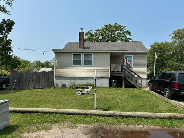 159 Forest Rd E, Mastic Beach, NY 11951 - view of front facade featuring a chimney